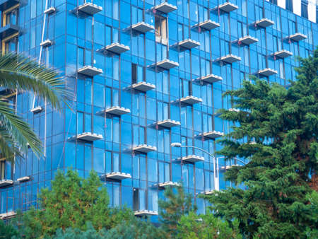 Part of a high-rise building under construction. End of construction. Finished works. Facade of a new beautiful skyscraper. modern engineering. resort townの写真素材