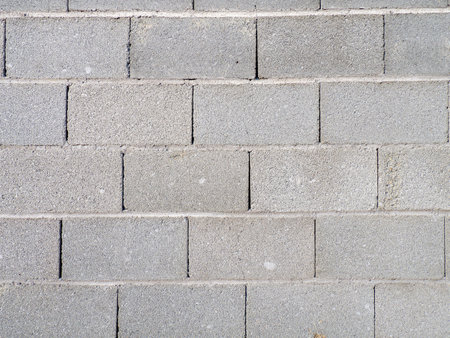stone gray masonry. Wall. strong fence. Background from cement blocks. strong masonryの写真素材