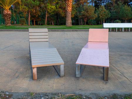Bench for lying. Bench on the sea front. resort town. Place for sunbathing. vacation time.の写真素材