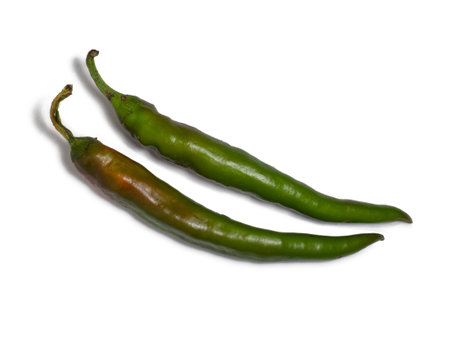 Fresh green chili peppers. Spicy vegetable isolate. Peppers on a white background. Ingredient for dishes. The concept of spicy food. fresh chili pepper. Harvesting vegetables for seasonings. healthy foodの写真素材