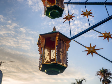 A small Ferris wheel in the park. A bright attraction for children. entertainment in the park. Colorful boots. High above the ground. children's fun. Entertainment industry concept. Fairy tale carouselの写真素材