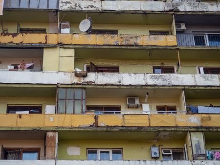 Batumi, Georgia. 08.16.2022 Old skyscraper. Cracked and shabby house. Nine-story building on the outskirts. Slum.のeditorial素材