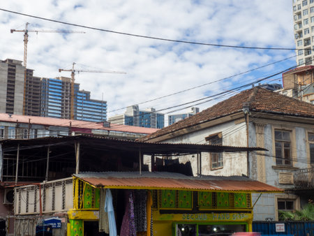urban architecture. Building on the outskirts of the city. Slums and old houses. Contrasts of architectureの写真素材