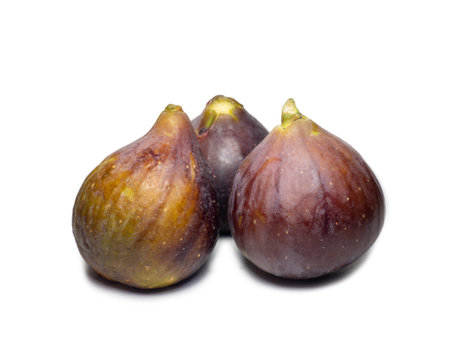 Ripe figs on a white background. Several figs. Southern fruit isolate. Purple fruit. Healthy diet. For dietの写真素材