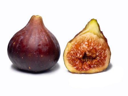 Ripe figs on a white background. Southern fruit isolate. Sliced purple fruit. healthy diet. For dietの写真素材