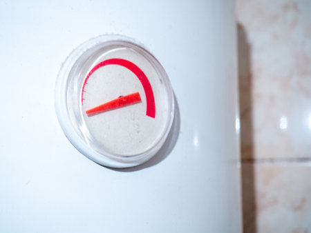 Titanium sensor. The dial on the water heater. Appliance in the bathroom. Titanium capacitance indicator. primitive techniqueの写真素材