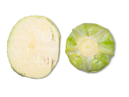 Pieces of white cabbage on a white background. From the garden. vegetable isolate. cut cabbage. Healthy lunch ingredient. Healthy food concept. An ingredient for borscht. Can be eaten rawの写真素材