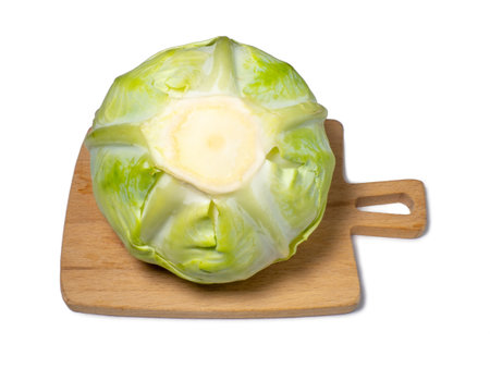 White cabbage on a cutting board on a white background. From the garden. vegetable isolate. Whole cabbage. Healthy lunch ingredient. Healthy food concept. An ingredient for borscht. Can be eaten rawの写真素材