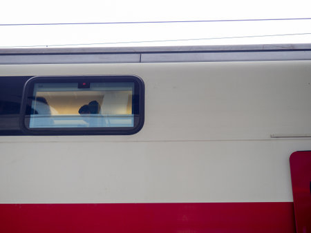 Batumi, Georgia. 07/10/2022 At the pier near the departing train. train locomotive. Georgian railways. Train window.. Passenger train at the station. Passenger transportationのeditorial素材