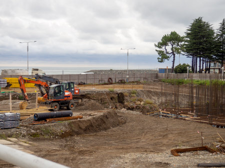 Construction of the foundation of a large complex. Workplace of builders. Construction of concrete walls.の写真素材