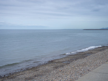 gray seashore. autumn sea. Resort out of season. empty beach. Empty dull gray landscapeの写真素材