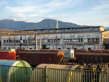 Batumi, Georgia. 12/10/2022 Tank car behind the fence. Flammable cargo. Cargo transportation. Freight train car. Fuel in a large container.のeditorial素材