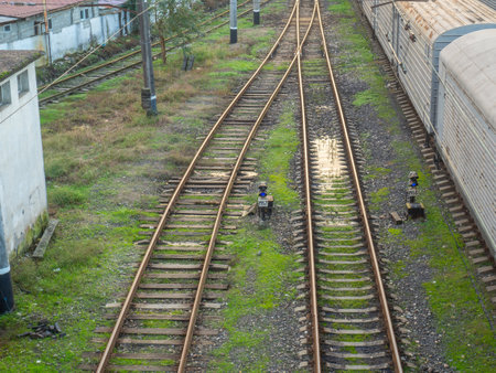 railway station. Rails with sleepers on top. Puddles between the rails. Abandoned place. old station. Cargo transportation. industrial zoneの写真素材