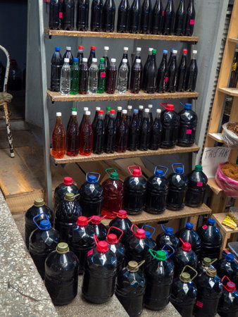 Batumi, Georgia. 10.22.2022 Georgian wine on the counter. Homemade wine in the market. different kinds. Homemade alcohol assortment. Store in Georgia. east market. Drinking from grape juiceの写真素材