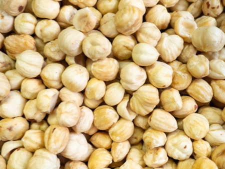 shelled hazelnuts. Background of nuts without shells. Snack on the table. Squirrel food. Lots of nuts. Hearty ingredient. Tasty food. market stall. Choice of ingredients for cooking. Health food. Raw food diet. Vegetarianの写真素材