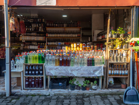 Batumi, Georgia. 10.22.2022 Georgian wine on the counter. Homemade wine in the market. different kinds. Homemade alcohol assortment. Store in Georgia. East market. Drinking from grape juiceのeditorial素材