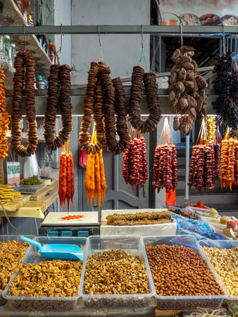 Peeled Georgian nuts. Background of nuts without shells. Snack on the table. Squirrel food. Lots of nuts. Hearty ingredient. Tasty food. market stall. Choice of ingredients for cooking. Bundles of figsの写真素材