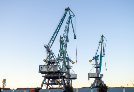 Port cranes against the sky. loading mechanism. sea port. sea freight conceptの写真素材