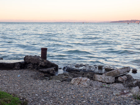 port area. The atmosphere of a cargo seaport. marine urban landscape. Old rusty bollard and concrete pierの写真素材