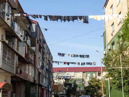 Colorful street. Yard with stretched clotheslines. Clothes are dried in the yard. Quiet backyard of Georgia. old architectureの写真素材