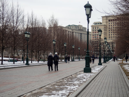 Alley in the park with lanterns. Cold season in the city. snow in the park. Moscow streetsの写真素材