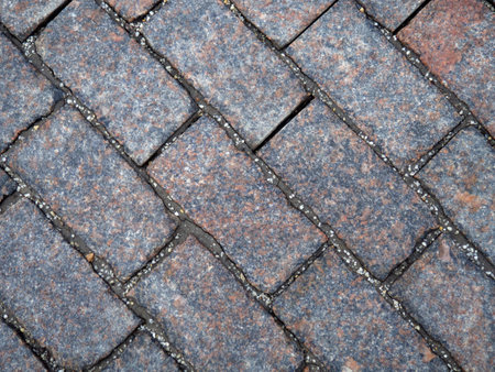 Paving stones on Red Square. A pattern of cobblestones on the pavement. Background of stone.Ancient paving stonesの写真素材