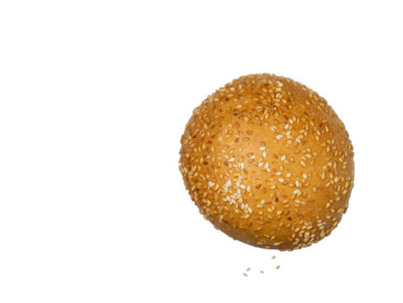 Round bun sprinkled with sesame seeds. Calorie food. bakery product. flour product. Bun on a white background. Fresh out of the oven. bread conceptの写真素材