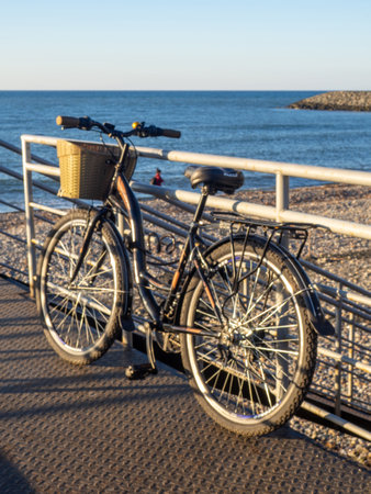 Bicycle with a basket on the seashore. sea transport. Outdoor recreation.Bokeh. Muddy haze. blurred imageの写真素材