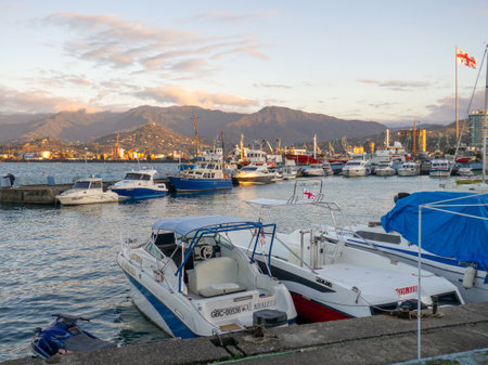 Batumi, Georgia. 11.15.2022 Boats in the sea port. Motor boats on the pier. autumn pier. Boats for rent. Navigationのeditorial素材
