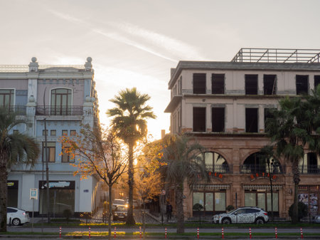 Batumi, Georgia. 11.15.2022 Streets of the old city at sunset. vintage architecture. urban landscape. Beautiful zaka. The sun sets behind the housesのeditorial素材