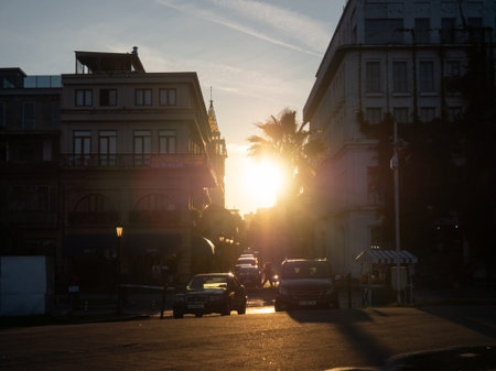 Batumi, Georgia. 11.15.2022 Streets of the old city at sunset. vintage architecture. urban landscape. Beautiful zaka. The sun sets behind the housesのeditorial素材