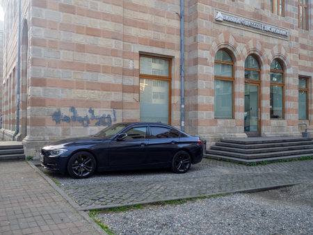 Batumi, Georgia. 21/11/2022 Expensive car at the old house. Batumi architecture. business. vehicle against the wallのeditorial素材