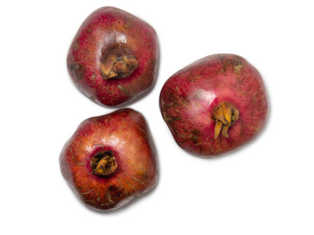 Pomegranate on a white background. Juicy fruit with seeds. Whole red fruit. pomegranate isolate. Juice ingredient. Vegetarianismの写真素材