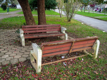 Benches on the street. urban environment. Old benches made of wood and stone. Cozy placeの写真素材