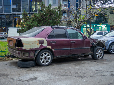 An old disassembled car. Abandoned car. Scrap metal in the yard. Not working, brokenの写真素材