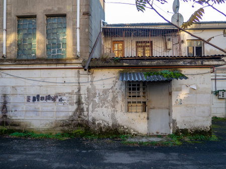 old yard. Facade of an old building. Outskirts of the southern city. Batumi architecture.の写真素材