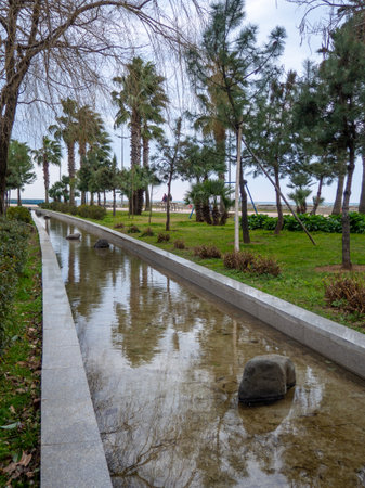 Fountains not working in winter. Winter in the park on the Black Sea coast. Batumi. The streets of the city. Water in the park. Out of season at the resortの写真素材