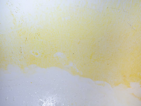 Mold on bathroom enamel. Black dots of mold and yellow plaque. Requires cleaning. Before using cleaning products. Dirt in the bathroomの写真素材