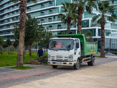 Batumi , Georgia. 02.04.2023 Batumi , Georgia. Gardening machine. Truck for loading branches and other garden debris. Gardeners pruned treesのeditorial素材