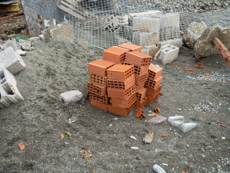 Building blocks on the ground. Material for the construction of warm houses. Progress. Construction from hollow concrete blocks.の写真素材