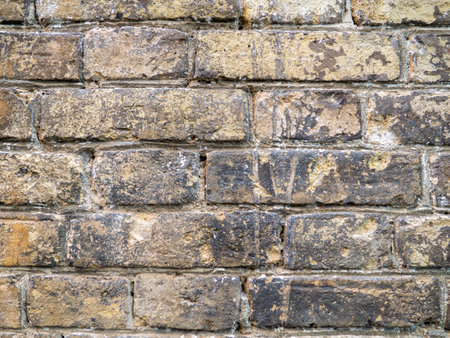 Wall of the old church. Background from brown bricks. Stone pattern. Construction. Old brick layingの写真素材