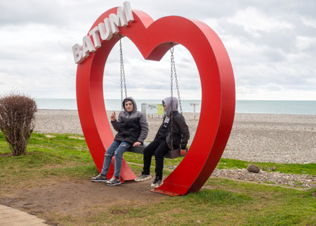 Batumi, Georgia. 02.10.2023 I love Batumi. Place for photo tourists. Swing in the heart. Beautiful place. At the resort in winterのeditorial素材