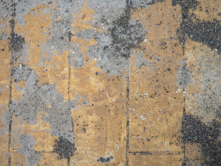 Background of brown tiles and small pebbles. Solid material pattern. Pebbles on tiles. Sidewalk surface in the park.の写真素材