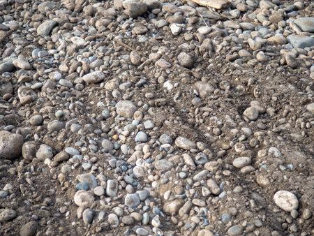 Repair of the embankment of the seaside resort. Preparing for the tourist season. Leveling the ground on the beach. Repair work. Mess.の写真素材