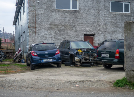 Batumi, Georgia. 03.12.2023 Auto repair shop. broken cars. Industry. Scrap metal. To be renovated. Non-working cars in the yardのeditorial素材