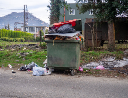 Container full of trash. Concept of ecological problem. Environmental pollution. Poor garbage disposal. Municipal services do not work.の写真素材