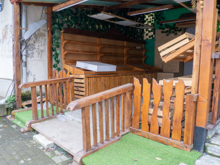 Empty shop. Broken small business. End of the working day. The vegetable shop is closed. Wooden counterの写真素材