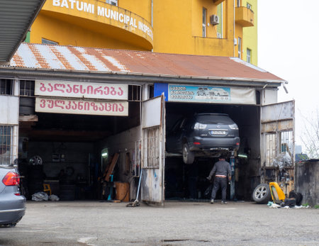 Batumi, Georgia. 03.18.2023 Auto repair shop with two boxes. Business in Batumi. Car repair. Vintage auto repair shopのeditorial素材