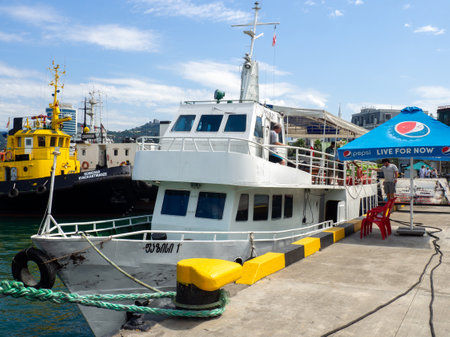 Batumi, Georgia. 07.15.2023  Ships in the port bay. Fishing trailer. Sea transport. Industry. In the Black Sea port. Batumi. The tugboat is moored in the port. Ship at the pierのeditorial素材