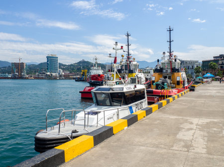 Batumi, Georgia. 07.15.2023  Ships in the port bay. Fishing trailer. Sea transport. Industry. In the Black Sea port. Batumi. The tugboat is moored in the port. Ship at the pierのeditorial素材